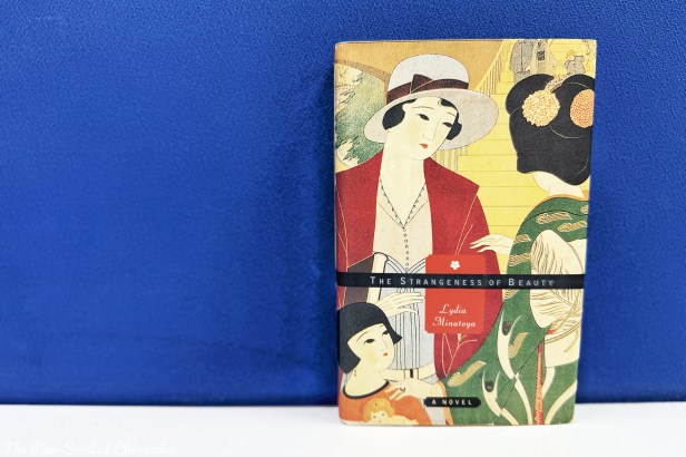 Book Review # 573: The Strangeness of Beauty – The Pine-Scented Chronicles